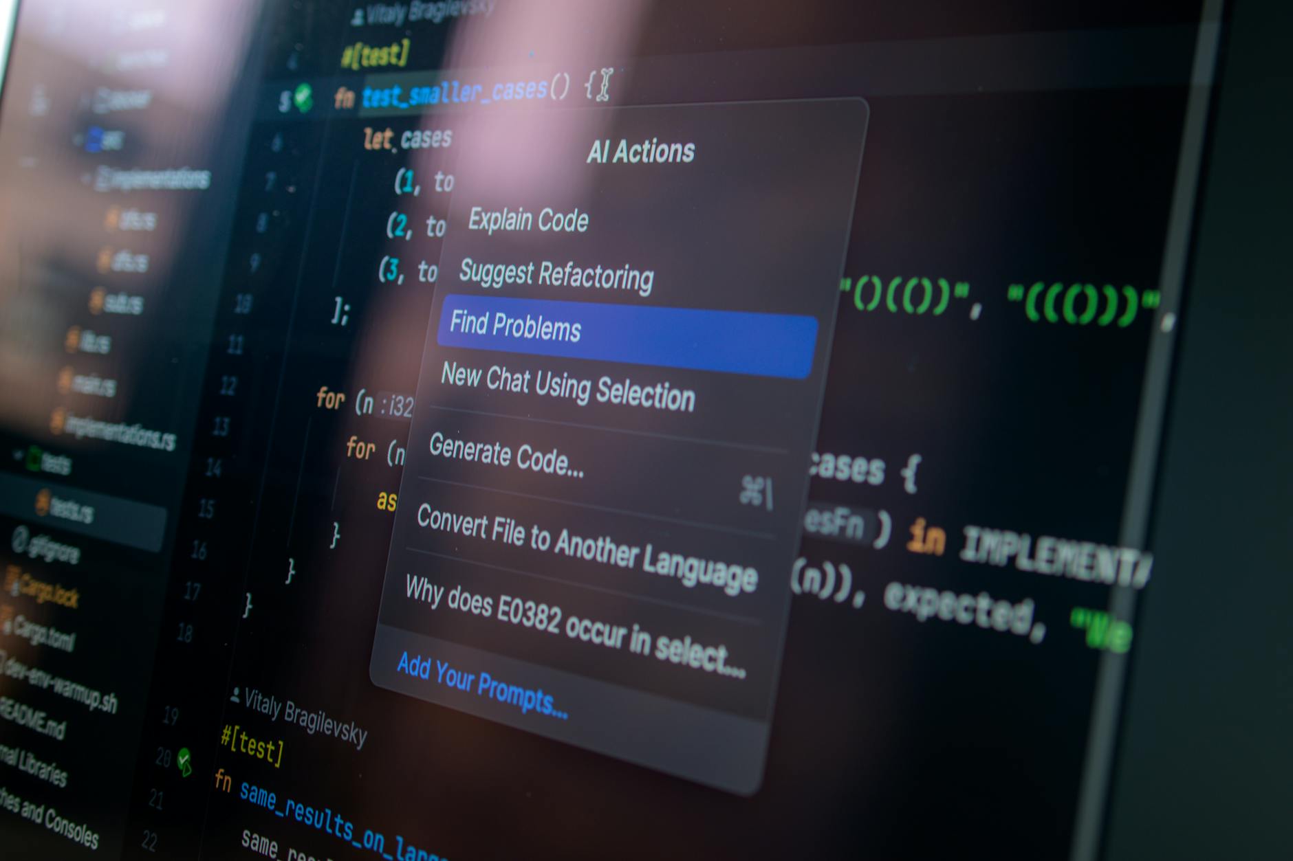 Monitor z kodem i menu akcji AI podczas tworzenia oprogramowania